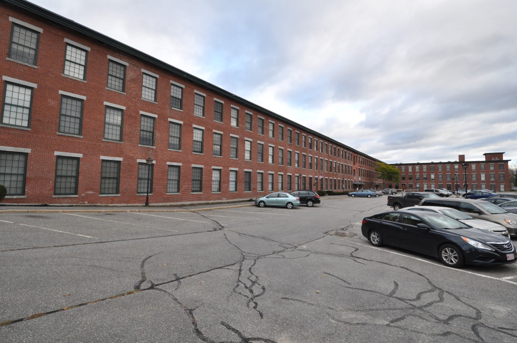 The long red-brick Farwell Mill building in Lisbon, Maine
