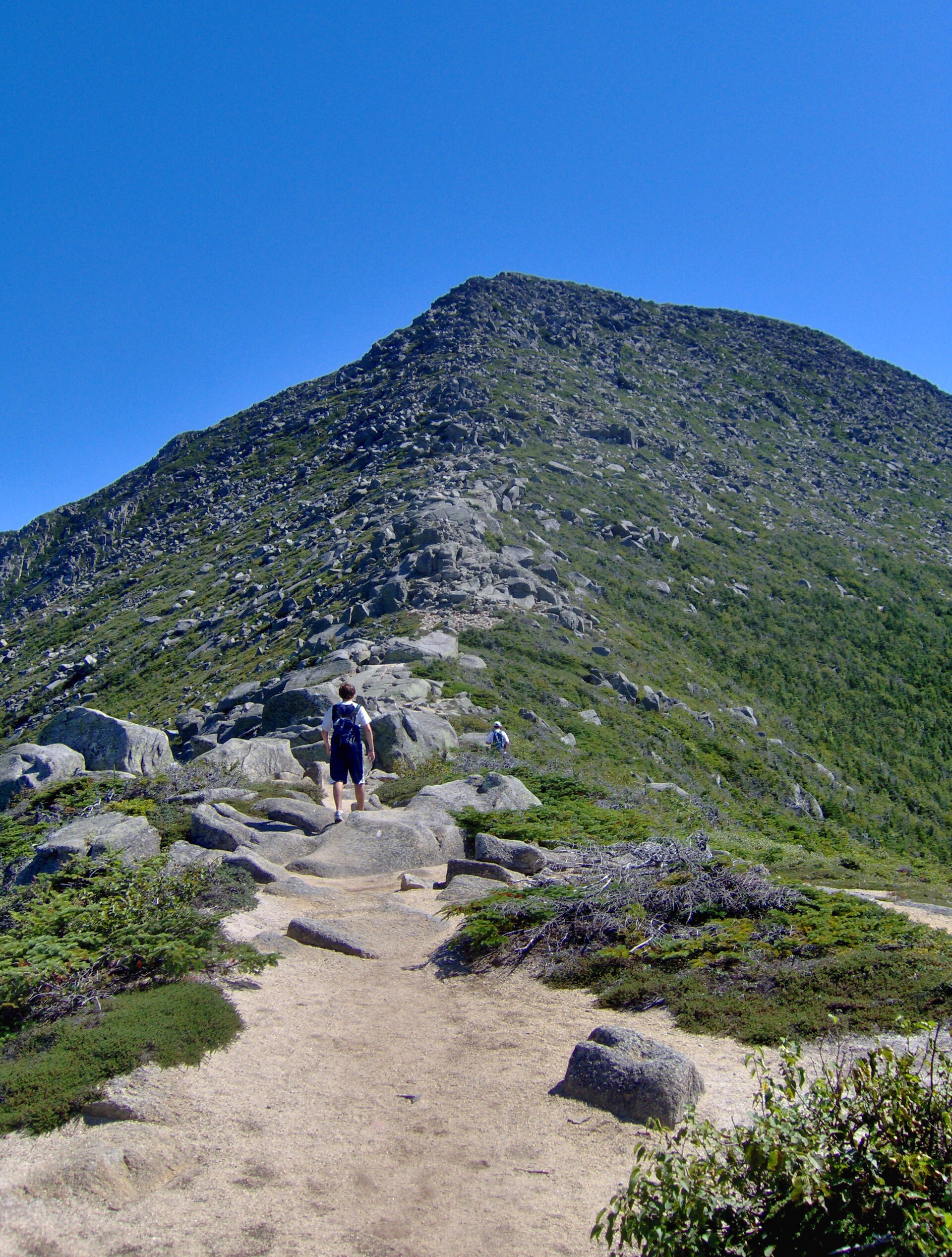 Hikers on the rocky trail leading up to the summit of Mount Katahdin, Maine