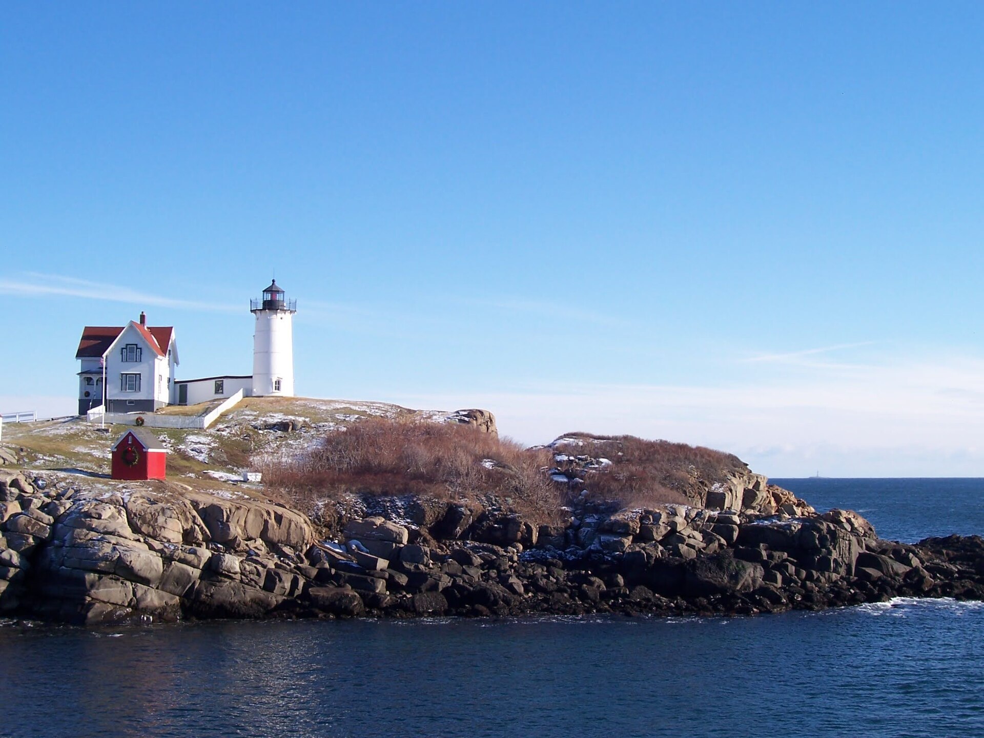 The Nubble (Cape Neddick Light) with its keeper's house on a rocky island off York, Maine