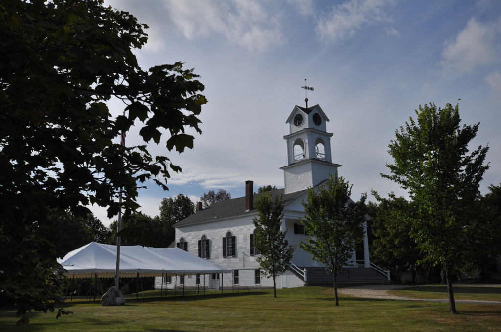 The historic white Baptist church with a clock tower at Paris Hill, Maine