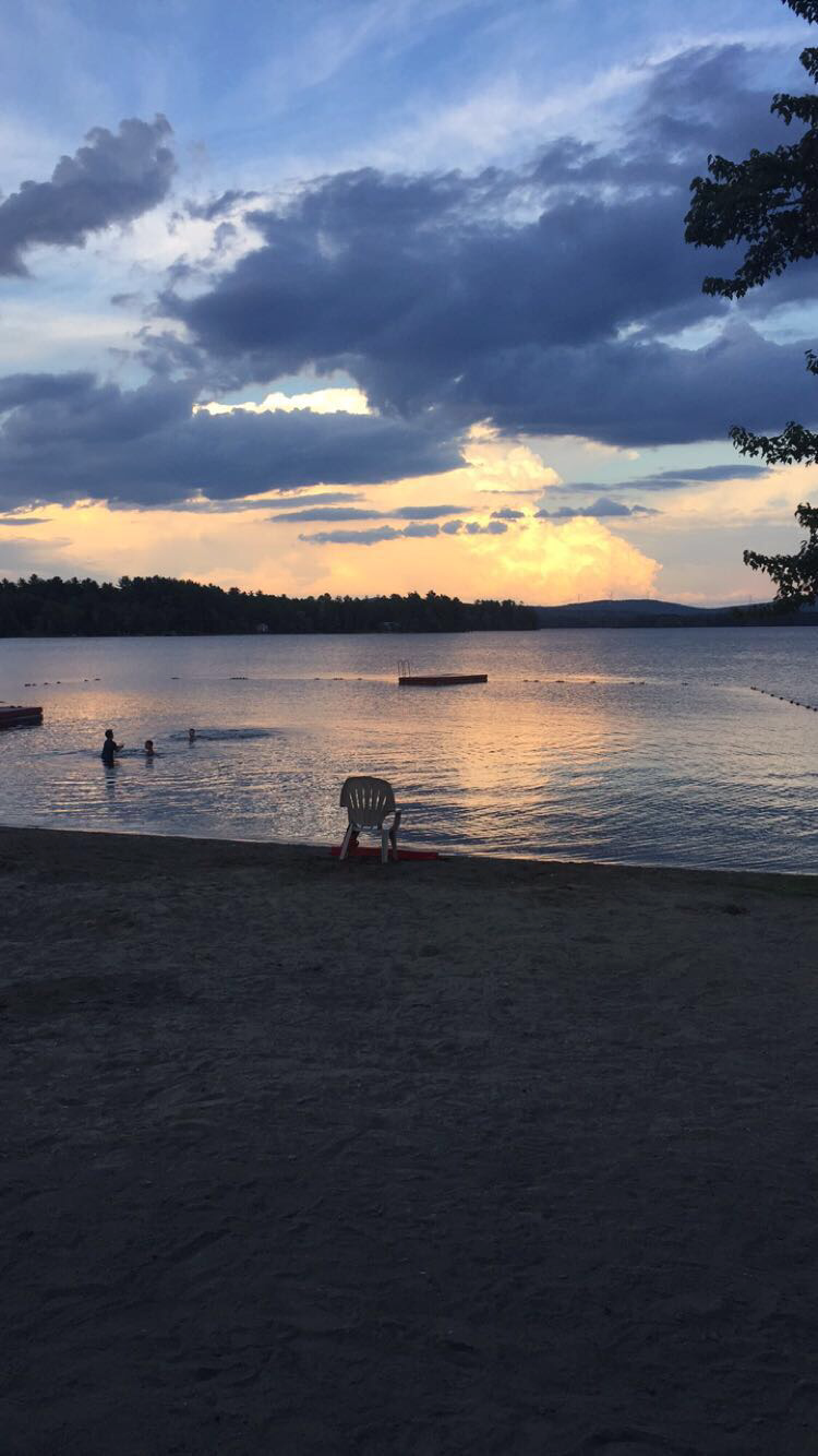 Sunset over the swimming beach at Prince Thomas Park on Mattanawcook Lake in Lincoln, Maine