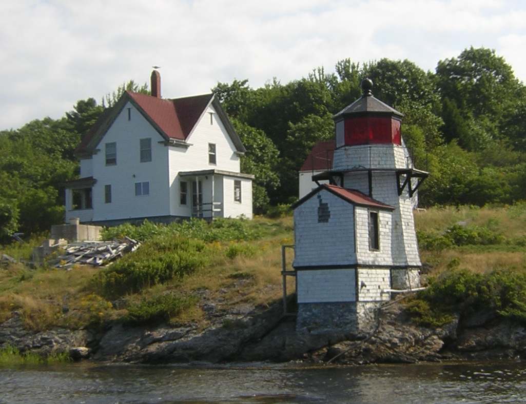 Squirrel Point Lighthouse and keeper's house on the wooded bank of the Kennebec River, Maine