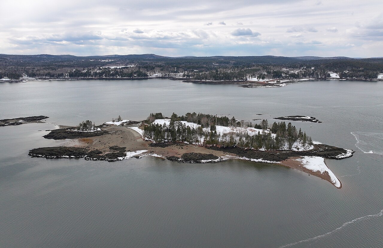 Aerial view of small, tree-topped St. Croix Island in the St. Croix River near Calais, Maine